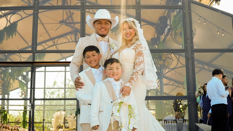 Jose Ortiz with his wife Savannah and their two sons at a family celebration