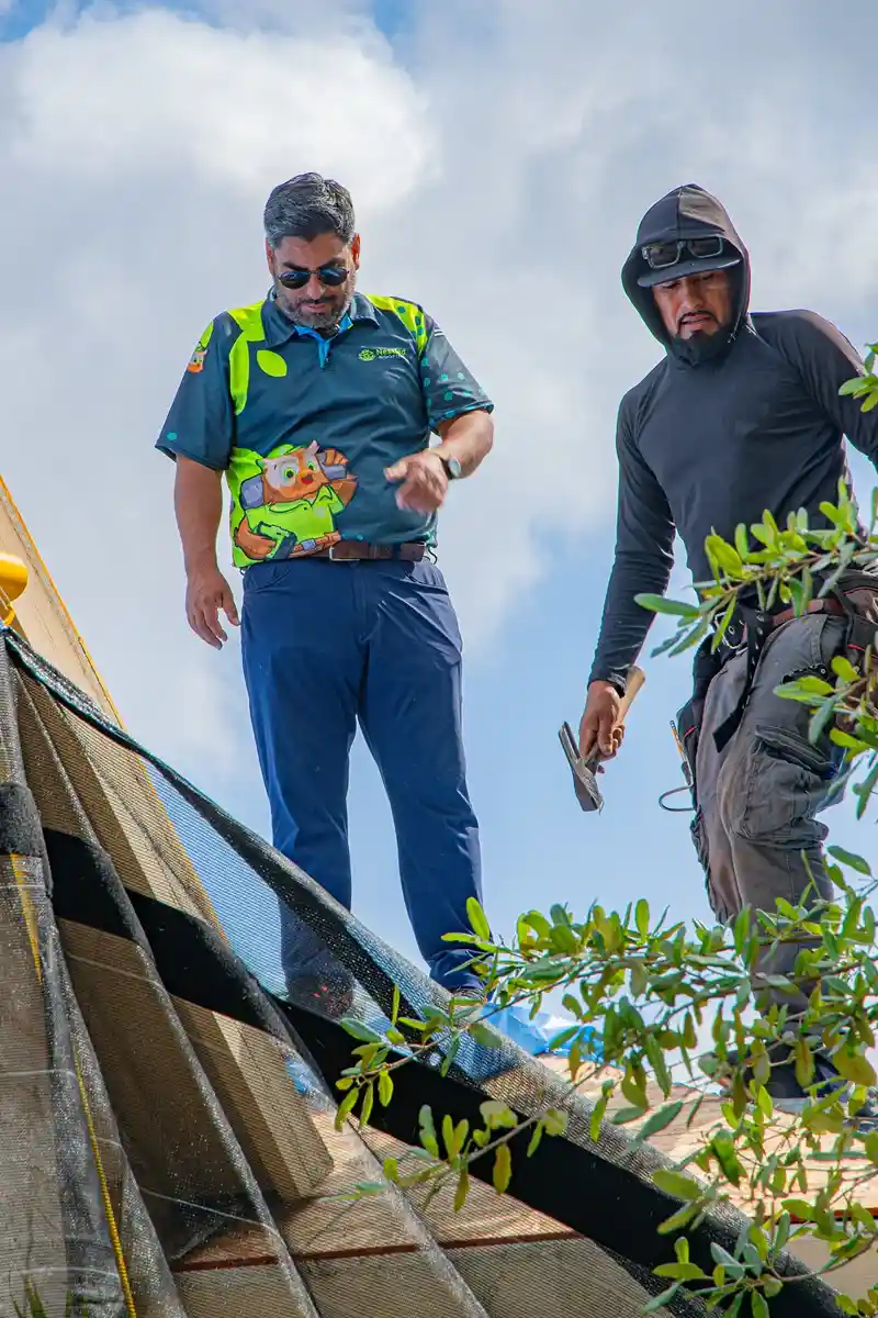 Nestled Roofing crew completing a full roof replacement on a San Antonio home